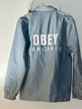 Obey Men’s Light Blue Windbreaker with White OBEY Worldwide Logo